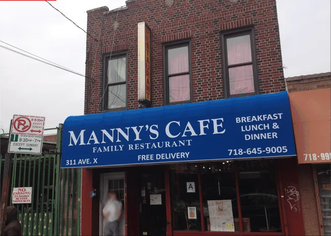 After: new blue Manny's Cafe awning